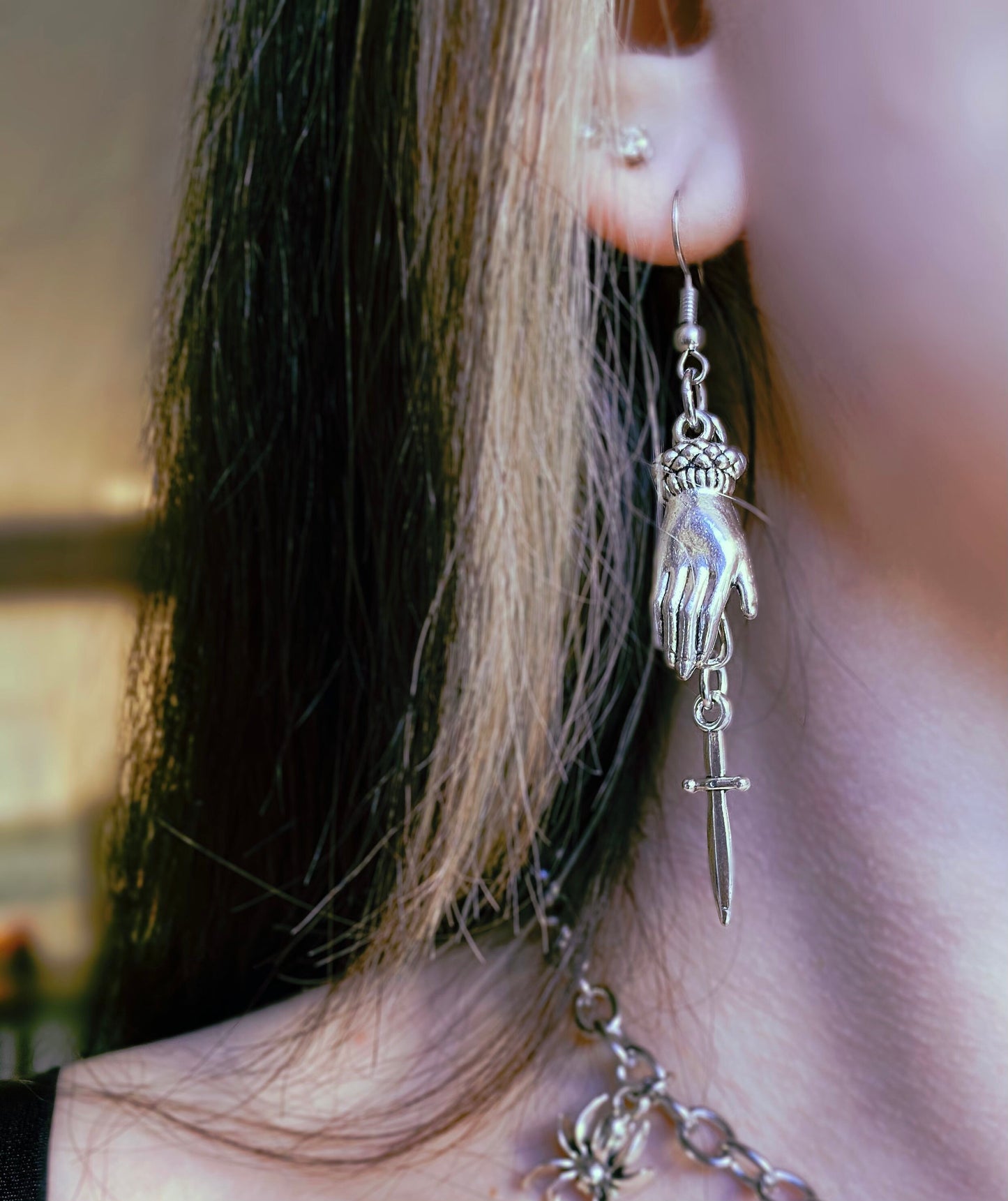 Hand and dagger earrings